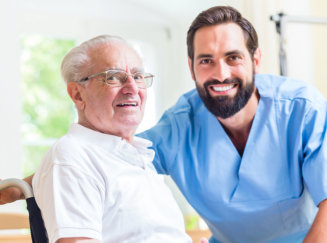 ale aide smiling with elderly man
