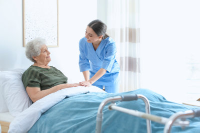 caregiver assisting senior patient