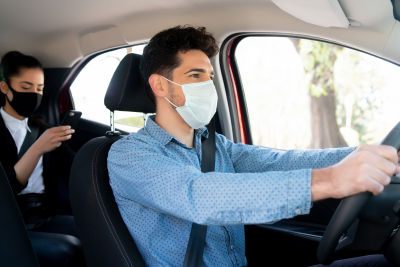 driver wearing face mask with passenger